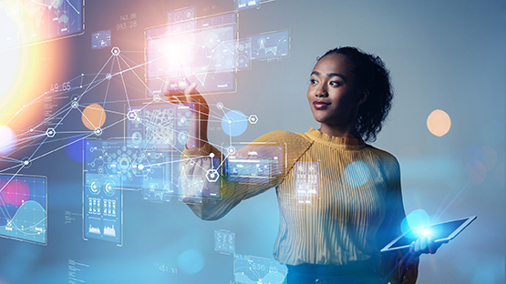 Young woman interacting with charts on a screen
