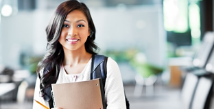 Young woman giving a presentation to fellow coworkers