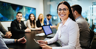 Workers at a conference room meeting