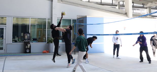 Students playing volleyball at Padron Campus