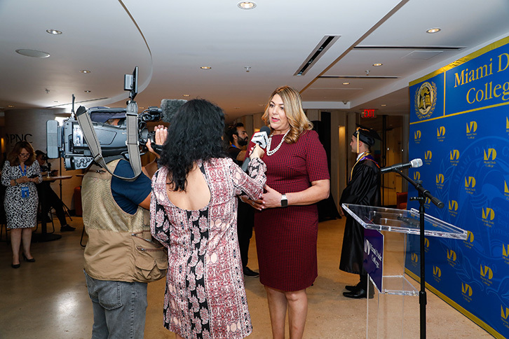 Reporters interviewing President Pumariega